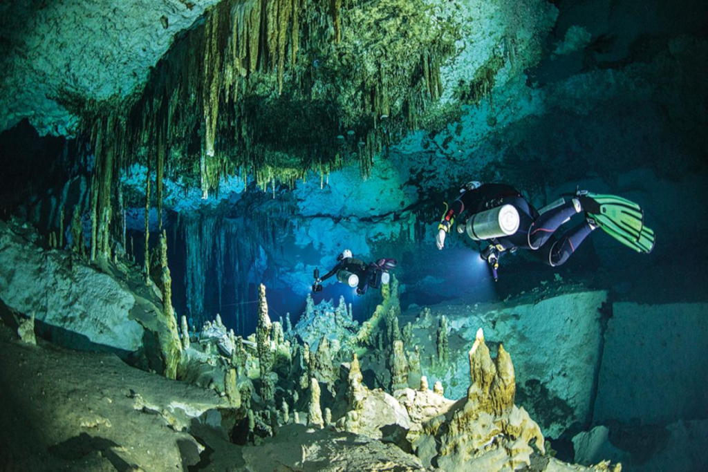 Cave divers with their equipement