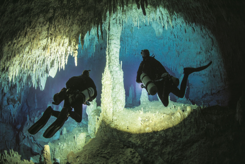 divers in a cave
